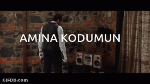 Man In Front Of Brick Wall Amina Kodumun GIF