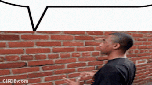 Man In Front Of Brick Wall With Speech Bubble GIF