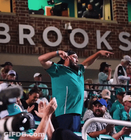 Man In Front Of Brooks Sign GIF