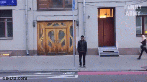 Man In Front Of Building Saying Funny Army GIF