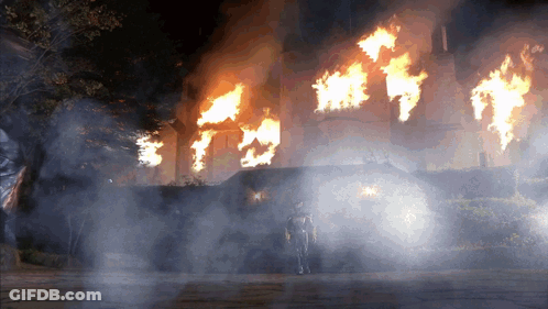 Man In Front Of Burning Building GIF