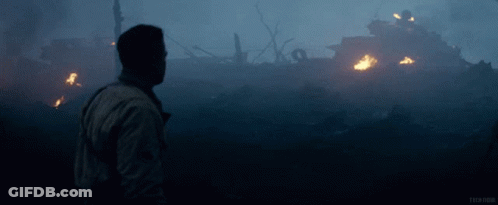 Man In Front Of Burning Building With Word Tech GIF
