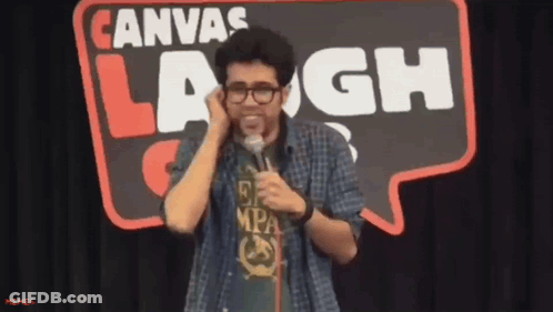 Man In Front Of Canvas Laugh Sign GIF