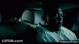 Man In Front Of Car With Lights On GIF