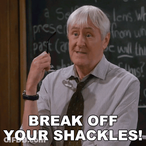Man In Front Of Chalkboard Saying Break Off Your Shackles GIF