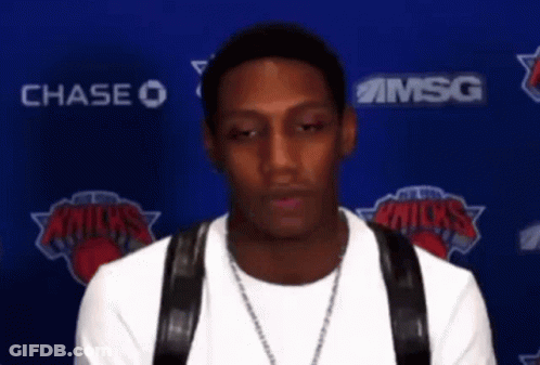 Man In Front Of Chase And Msg Logos GIF