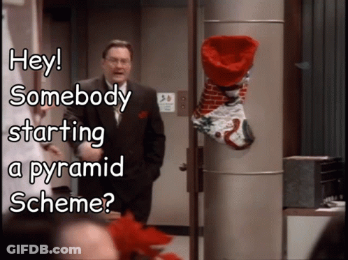 Man In Front Of Christmas Stocking Saying Hey Somebody Starting A Pyramid Scheme GIF