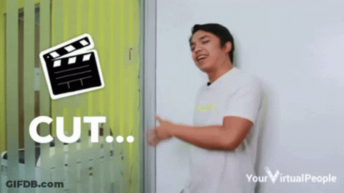 Man In Front Of Clapper Board Cut GIF