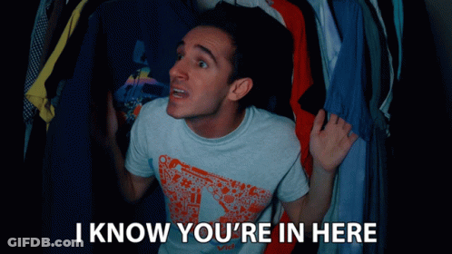Man In Front Of Closet Saying I Know You're In Here GIF