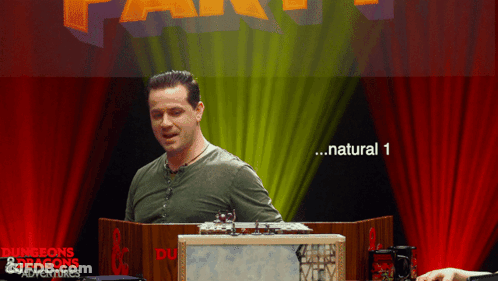 Man In Front Of Dungeons & Dragons Adventures Sign GIF