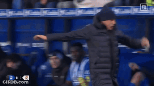 Man In Front Of El Corre Banner GIF