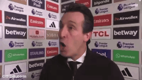Man In Front Of Emirates TCL Betway Ads GIF