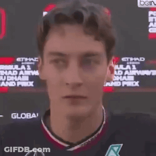 Man In Front Of Etihad Airways Sign GIF