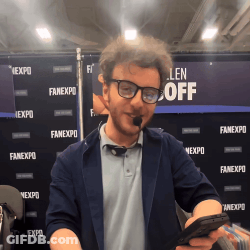 Man In Front Of Fanexpo Wall GIF