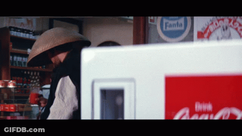 Man In Front Of Fanta Sign GIF