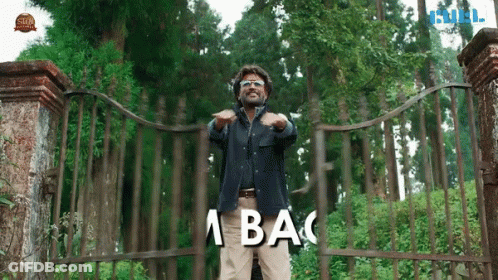 Man In Front Of Fence Saying A Ba GIF
