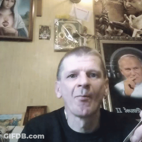 Man In Front Of Framed Picture Saying II GIF