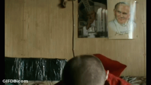 Man In Front Of Framed Picture Saying II GIF
