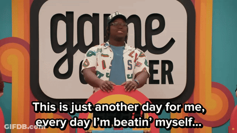 Man In Front Of Game Center Sign GIF