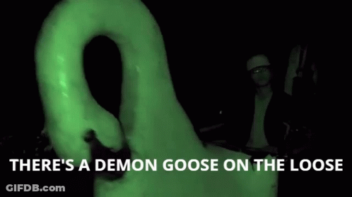 Man In Front Of Giant Goose Saying There's A Demon Goose On The Loose GIF