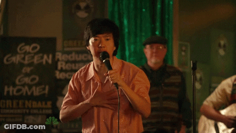 Man In Front Of Go Green Reduce Reuse Recycle Or Go Home Sign GIF