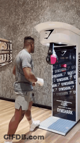 Man In Front Of Gymshark Machine GIF