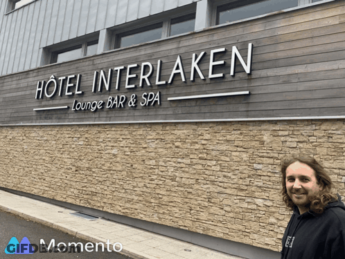 Man In Front Of Hotel Interlaken Lounge Bar & Spa Sign GIF