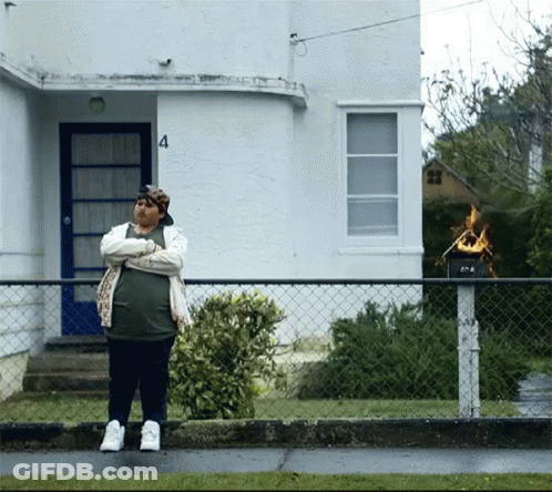 Man In Front Of House Number 4 GIF