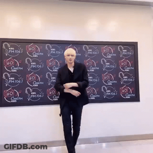 Man In Front Of KBS FM 106.7 Wall GIF