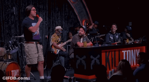 Man In Front Of Kill Tony Drum GIF