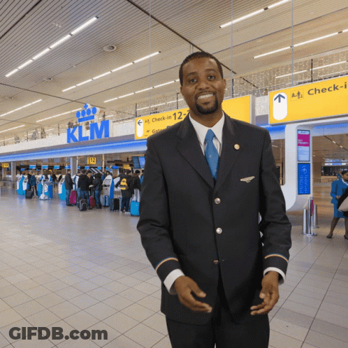 Man In Front Of KLM Sign GIF