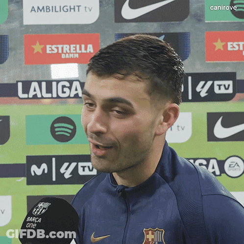 Man In Front Of Laliga And Ambilight TV Logos GIF
