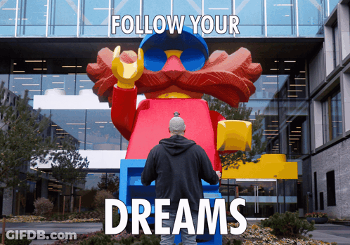 Man In Front Of Large Lego Statue Follow Your Dreams GIF