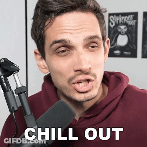 Man In Front Of Microphone Saying Chill Out GIF