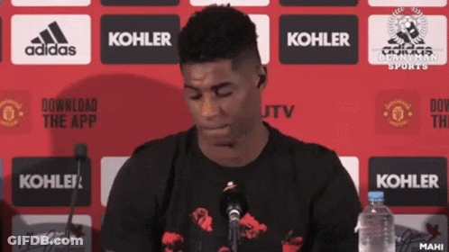 Man In Front Of Microphone With Kohler Logo GIF