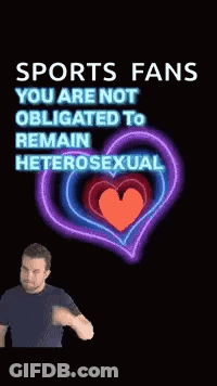 Man In Front Of Neon Heart Saying Sports Fans You Are Not Obligated To Remain Heterosexual GIF