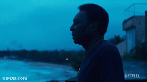Man In Front Of Netflix Sign GIF