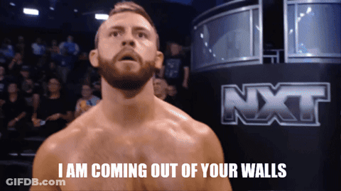 Man In Front Of NXT Logo GIF