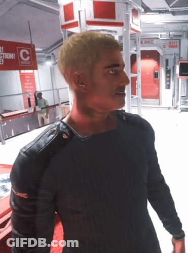 Man In Front Of Outlet Sign GIF