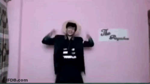 Man In Front Of Pink Wall Saying The Republic GIF