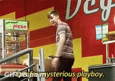 Man In Front Of Pizza Machine Saying Mysterious Playboy GIF