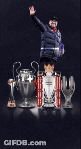 Man In Front Of Premier League Trophies GIF