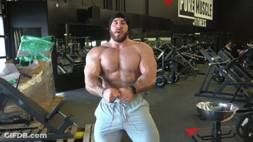 Man In Front Of Pure Muscle Fitness Gym GIF