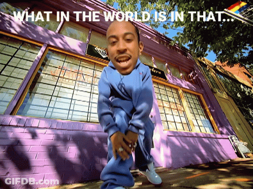 Man In Front Of Purple Building Saying What In The World Is In That GIF