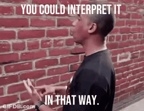 Man In Front Of Red Brick Wall Saying You Could Interpret It In That Way GIF