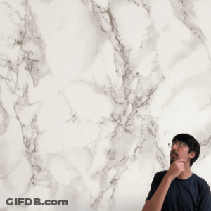 Man In Front Of Red Playing Card With Circular Pattern GIF