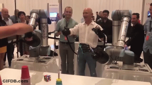 Man In Front Of Robot Arm Saying Shadow GIF