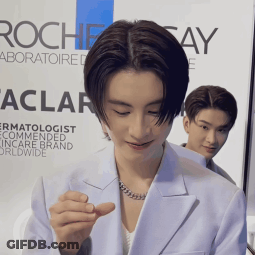 Man In Front Of Rochesay Sign GIF