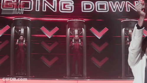 Man In Front Of Screen Saying Going Down GIF