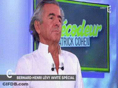 Man In Front Of Screen Saying Patrick Cohen GIF